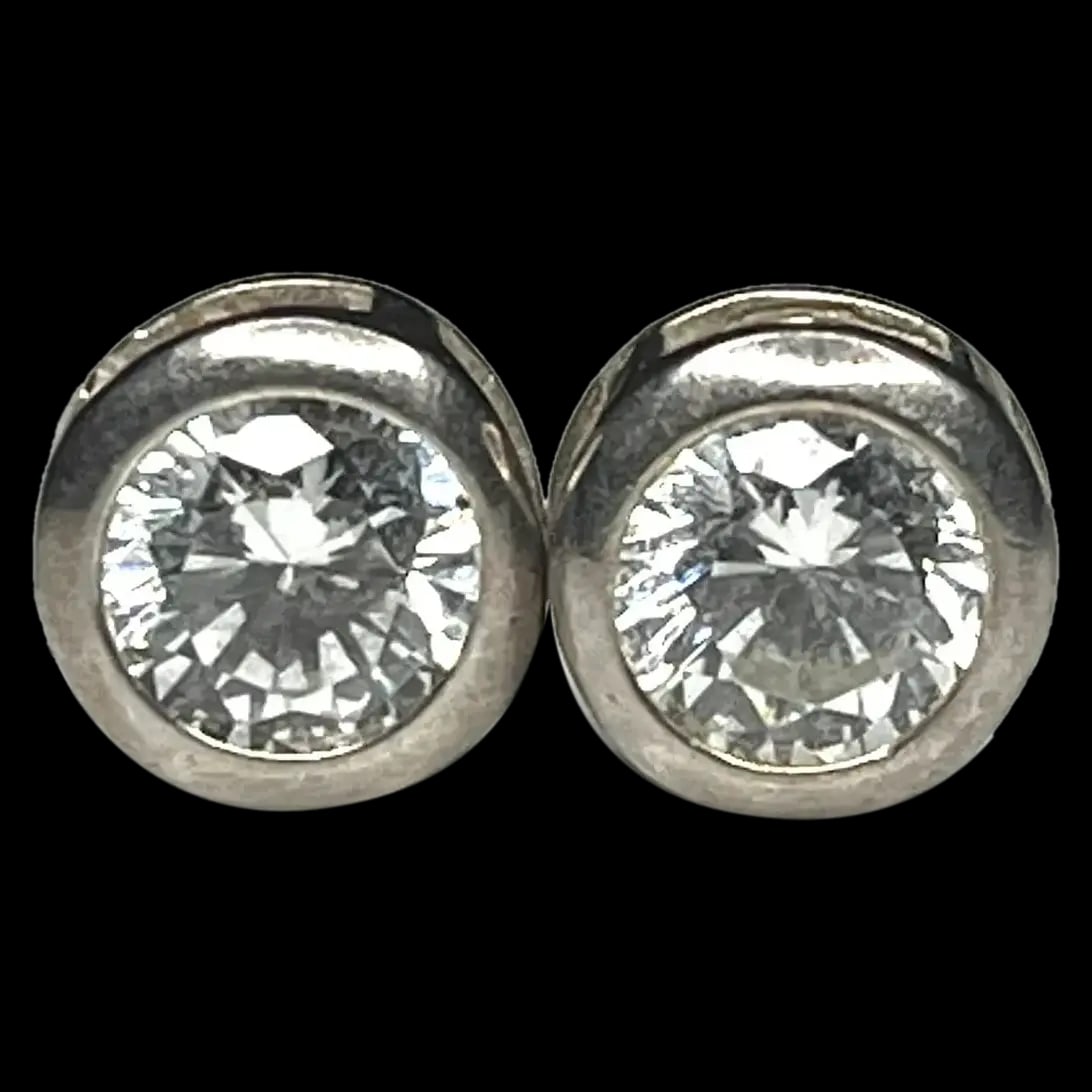Vintage Sterling Silver CZ Stud Earrings: Title: Vintage Sterling Silver CZ Stud Earrings Description: Vintage Sterling Silver CZ Stud Earrings Did not see a Hallmark- Test as Sterling Silver Pierced Earrings Weighs 1.5 grams Measures