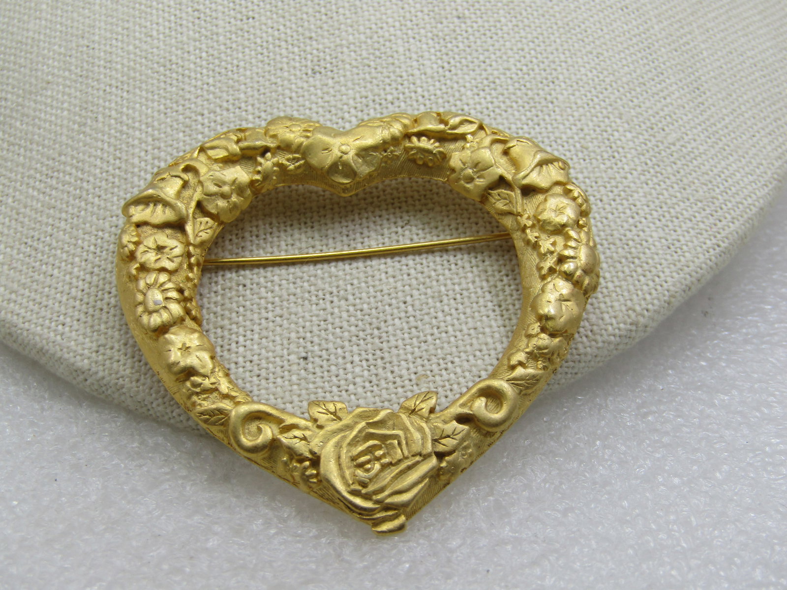 Vintage Floral Heart Brooch,, Signed JJ, Large 2.5": Vintage Floral Heart Brooch,, Signed JJ, Large 2.5", Satiny gold tone with a large rose at the bottom and a mis of repousse flowers around the heart. The heart is tapered thicker at the top and the bo