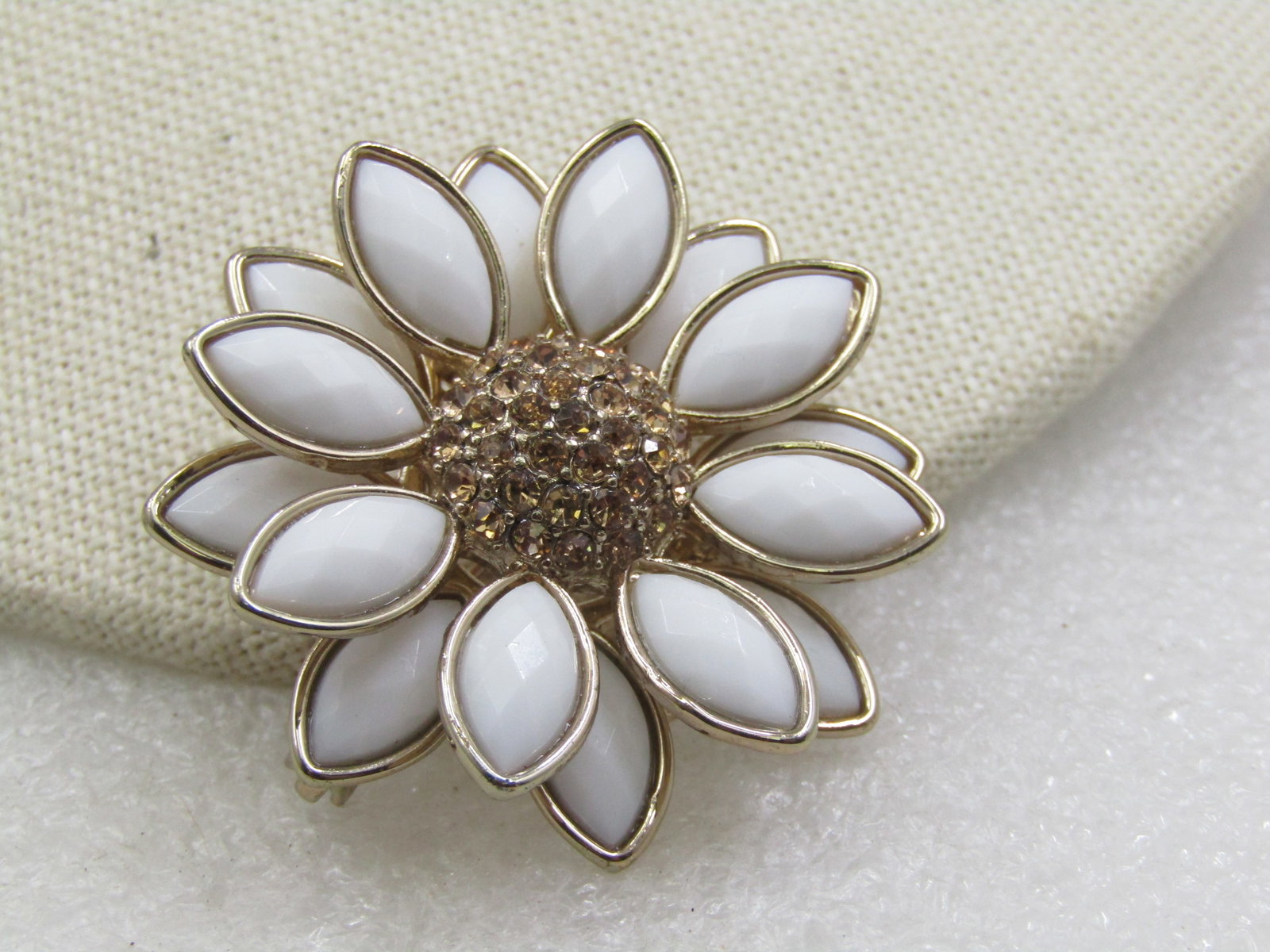 Vintage Napier White & Yellow Tiered Blossom, 1960's-1980's, 1.5": Vintage Napier White & Yellow Tiered Blossom, 1960's-1980's, 1.5" across. Two tiers of white faceted lucite marquise bezel-set stones and a center that is domed with gold rhinestones. It is a daisy