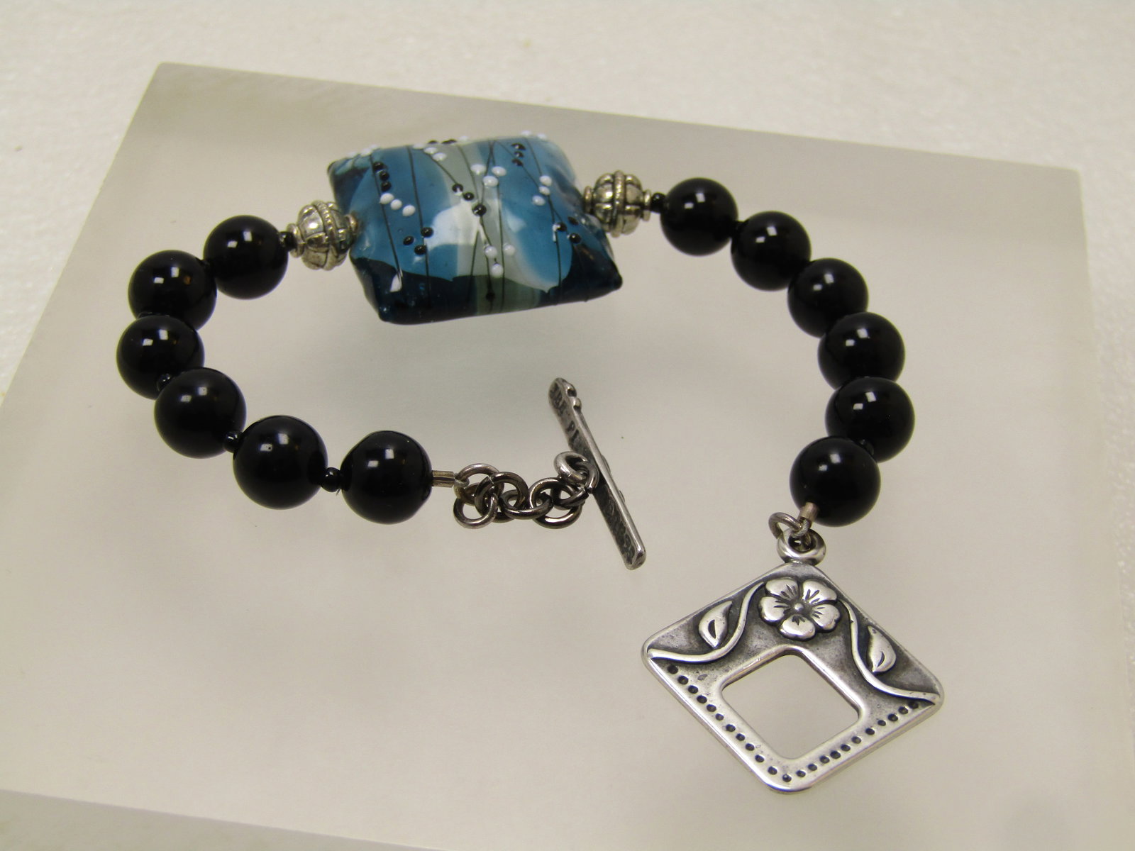 Sterling Blue/Black Art Glass Bracelet, Signed Joshua Benbassat (JBB), Floral Toggle Clasp, 7.5", - 5