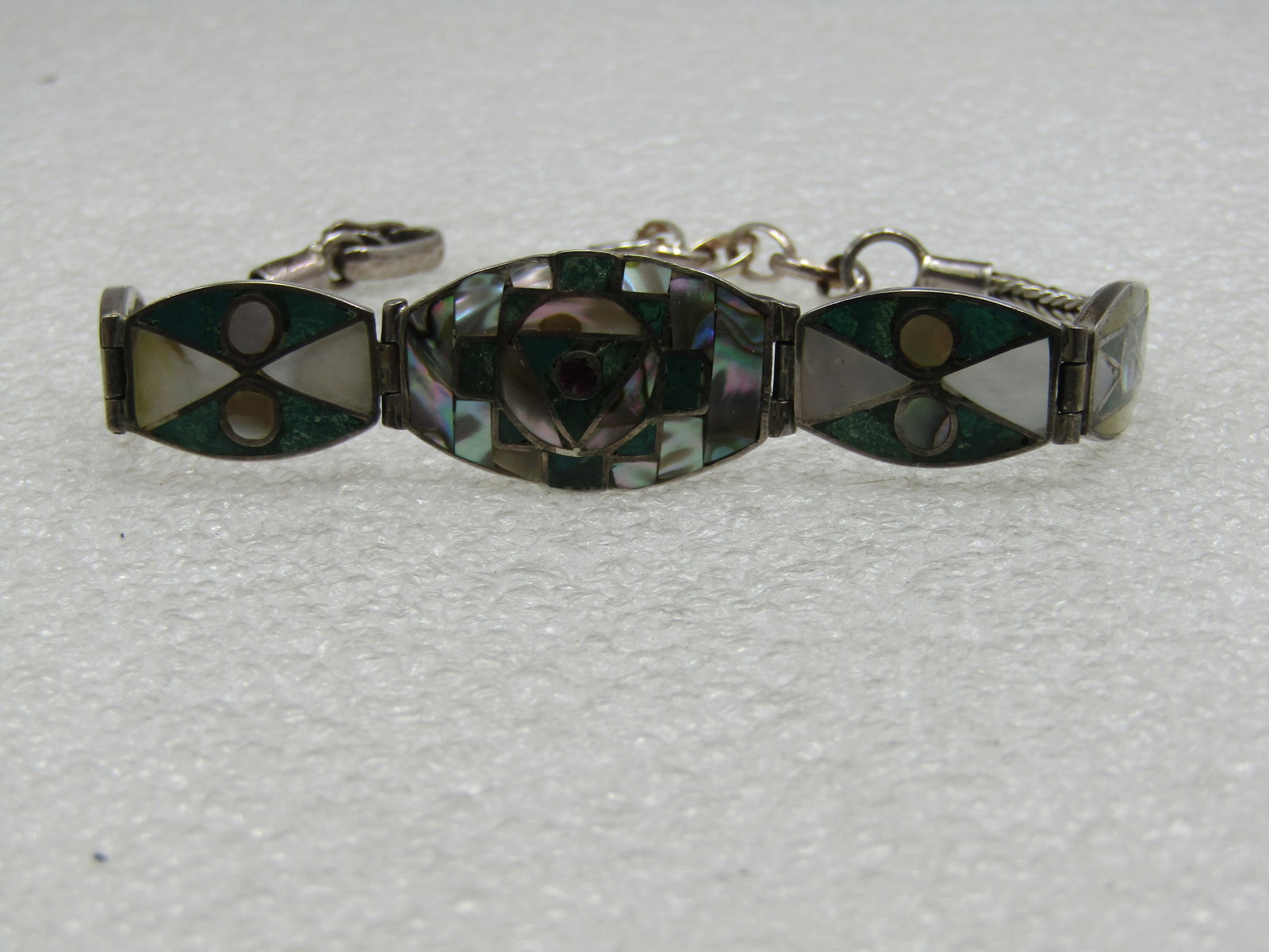 Vintage .950 Silver Southwestern Inlaid Sugalite, Marcasite, MOP, Abalone Bracelet,: Vintage .950 Silver Southwestern Inlaid Sugalite, Marcasite, MOP, Abalone Bracelet, 8" adjustable down to 6.5". Graduated links with the center being the larger with a center circle of sugalite set in