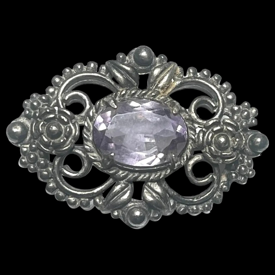 Vintage Silver Amethyst Ornate Floral Filigree Brooch: Title: Vintage Silver Amethyst Ornate Floral Filigree Brooch Description: Vintage Silver Amethyst Ornate Floral Filigree Brooch Did not see a Hallmarked/This piece has been tested as silver, so it is