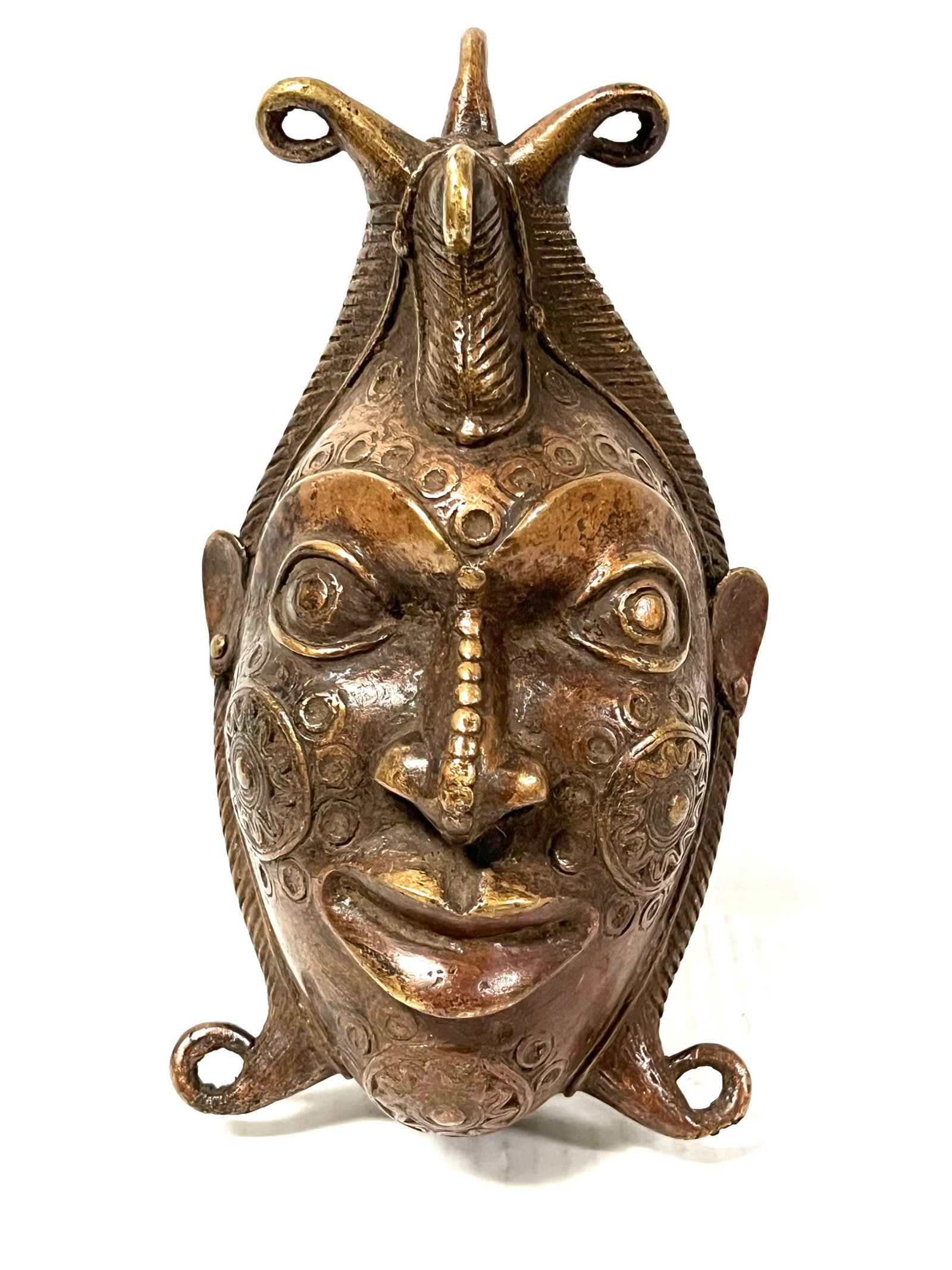 Bronze Bamileke Mask: Title: Bronze Bamileke Mask Date/Period: Late 20th Century Description: African Tribal Art Bronze Bamileke Mask Materials: Bronze Size: 9" h x 5" w Reserve: $400.00 Shipping: Domestic: Flat-rate of $