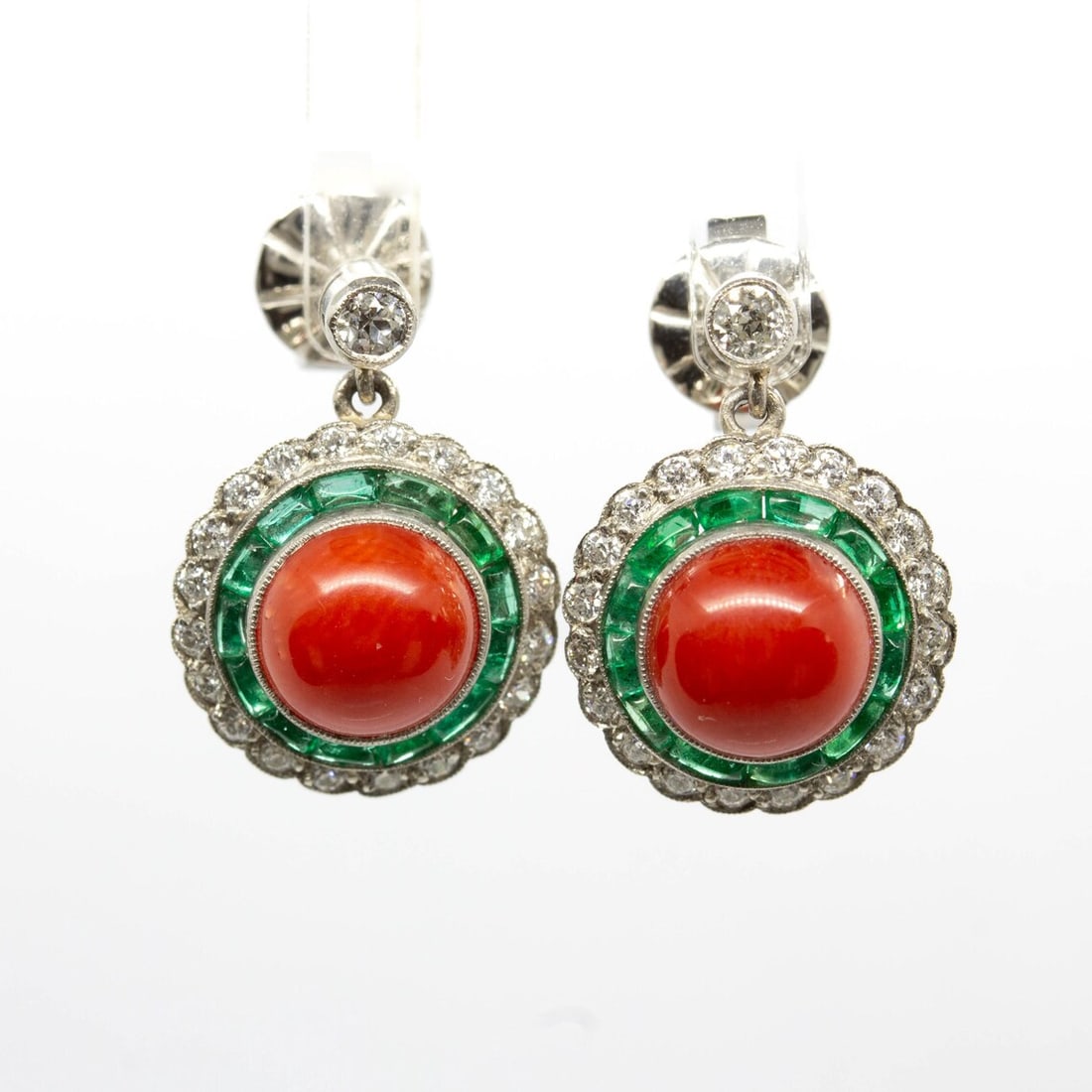 Art Deco Natural Coral, Emerald, and Diamond Earrings: Title: Art Deco Natural Coral, Emerald, and Diamond Earrings Description: Title: Art Deco Natural Coral, Emerald, and Diamond Earrings Description: Gemstone: Coral The Annika earrings ar