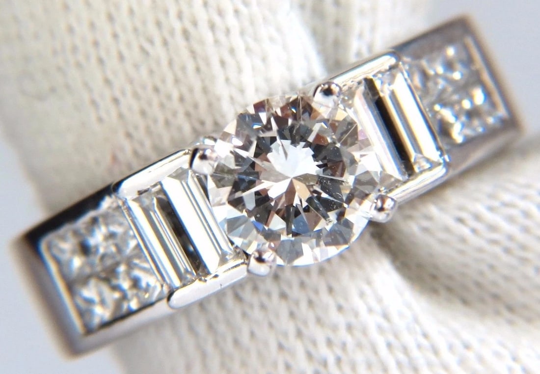 GIA Certified 1.02ct & 1.10ct round diamond baguette princess ring e/vs2 18kt+: Title: GIA Certified 1.02ct & 1.10ct round diamond baguette princess ring e/vs2 18kt+ Description: MAGNIFICENT JEWELS GIA 1.02ct. Round, brilliant diamond ring Report: 2171095429 (please see certifica