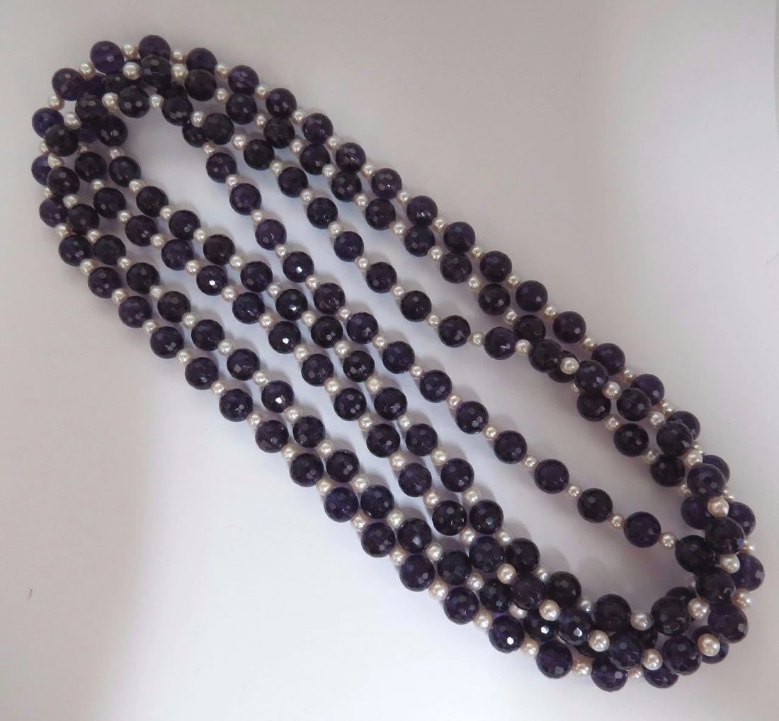 600ct natural amethyst bead necklaces (2)+**: Title: 600ct natural amethyst bead necklaces (2)+** Description: 600ct. Natural amethyst & cultured pearl necklaces Lot of 2 strands. 8mm Amethysts 4mm pearls Each Necklace: 36 inches long (wearable d