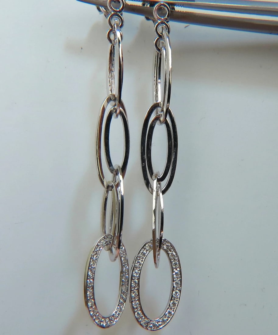 14KT GOLD .46CT ELONGATED OVALS DIAMOND DANGLE EARRINGS HINGED**: Title: 14KT GOLD .46CT ELONGATED OVALS DIAMOND DANGLE EARRINGS HINGED** Description: ONLY MAGNIFICENT JEWELS Hinged Elongated ovals dangle earrings .46ct. Round, Brilliant diamonds G color, VS-2 clari