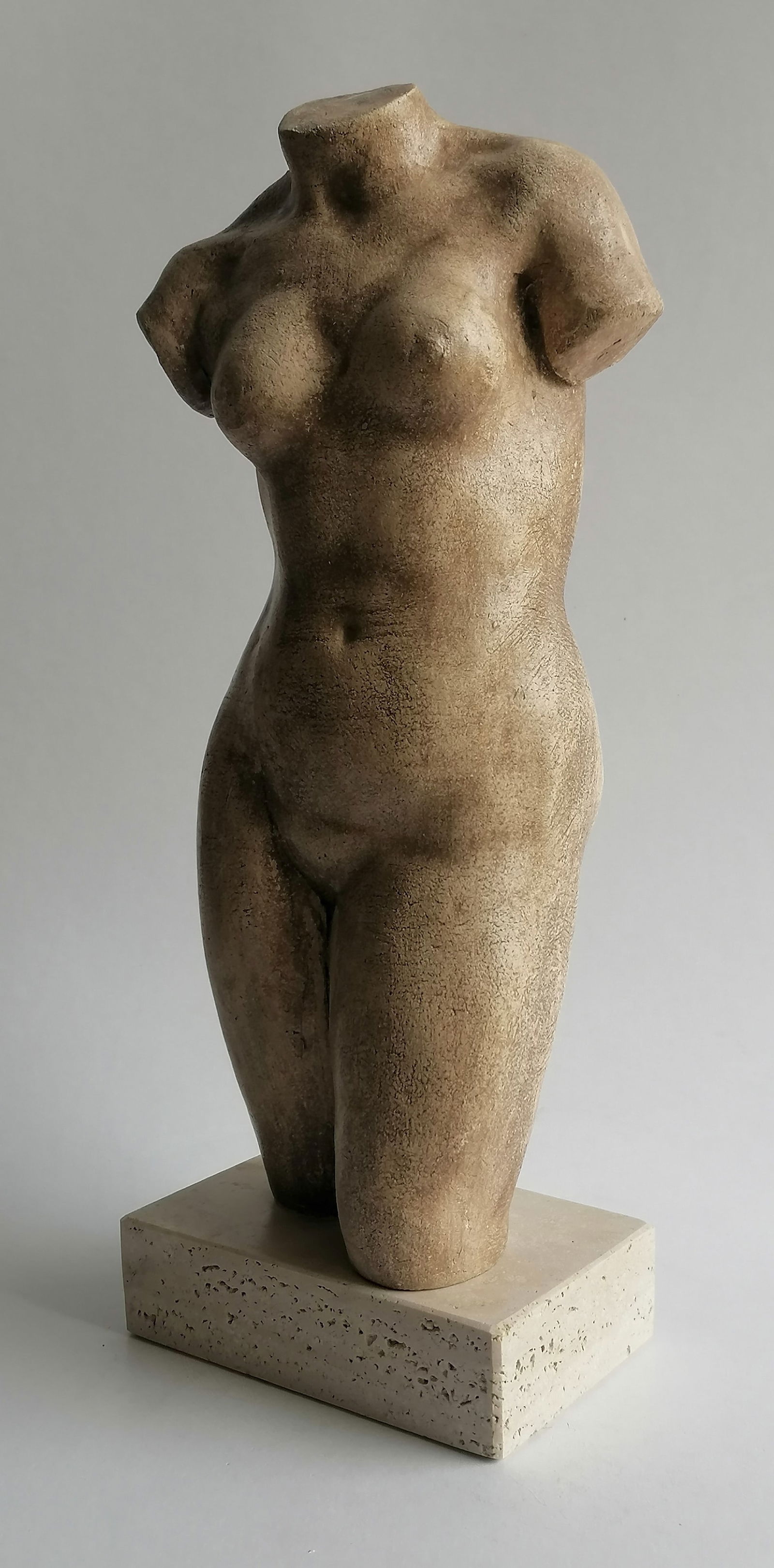 Female ceramic bust: Title: Female ceramic bustDescription:Handcrafted refractory ceramic female torso placed on a travertine stone base H 32 x 12 x 9 cm, weight 2 kgDate/Period: xx centuryMaterials:ceramicDimension:H 32