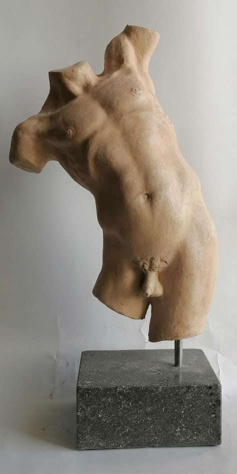Ceramic male torso: Title: Ceramic male torsoDescription:Male torso in dance position made of white refractory ceramic and placed on a basaltic stone baseDate/Period: xx centuryMaterials:ceramicDimension:H with base cm