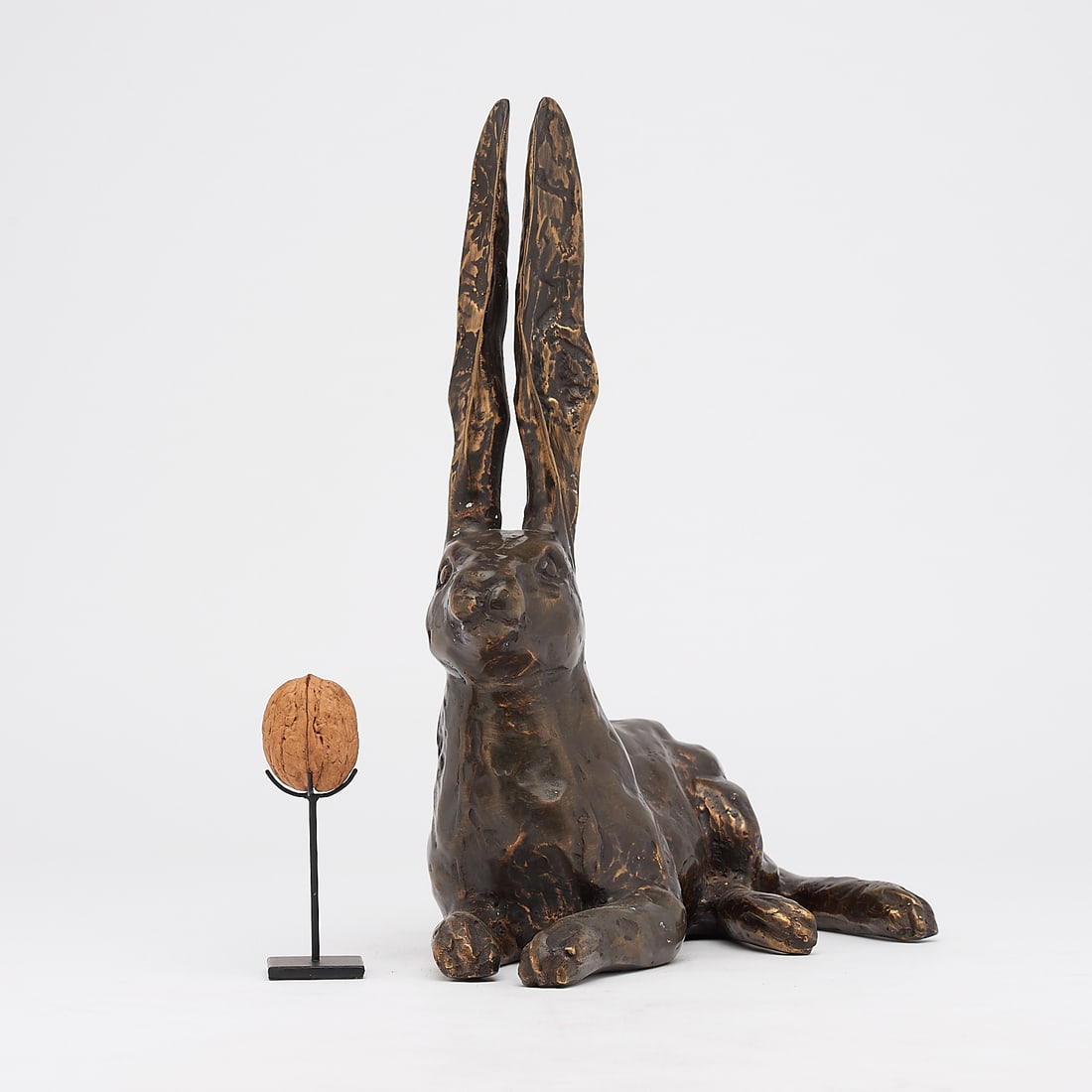 Resting hare ears up: Title: Resting hare ears upMaker:UnknownOrigin: IndonesiaDate/Period:2025Materials:BronzeDimensions:Height: 32 cm / 12.5 inches Width: 30 cm / 11.8 inchesDescription:This fine bronze hare sculpture