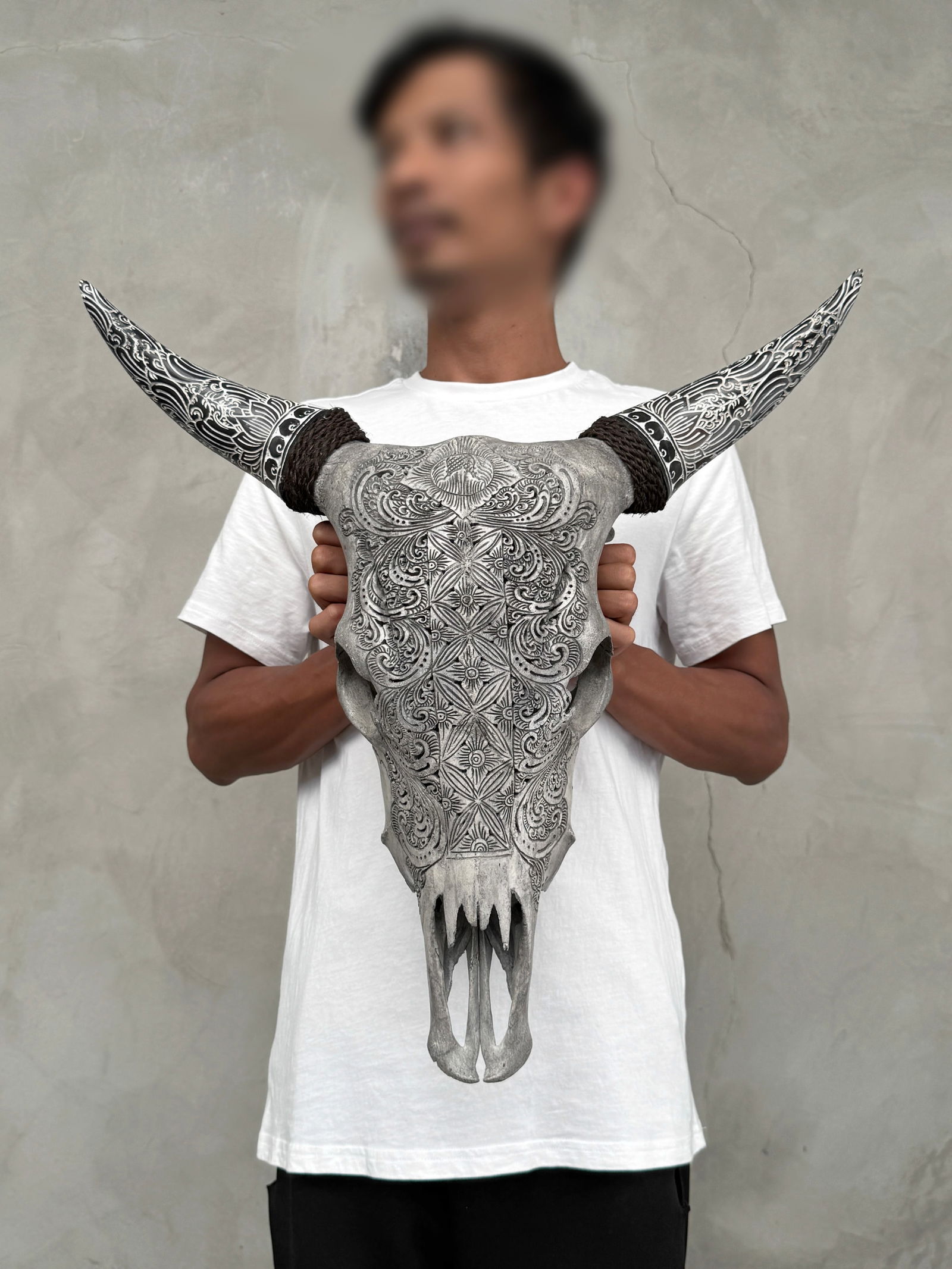 Carved cow skull with carved horns - Ketimun lotus motif: Title: Carved cow skull with carved horns - Ketimun lotus motif Maker:Unknown Origin: Indonesia Date/Period:2025 Materials:Bos Taurus, Bone, Horn Dimensions:Height: 53 cm / 20.8 inches W: 53 cm / 20.8