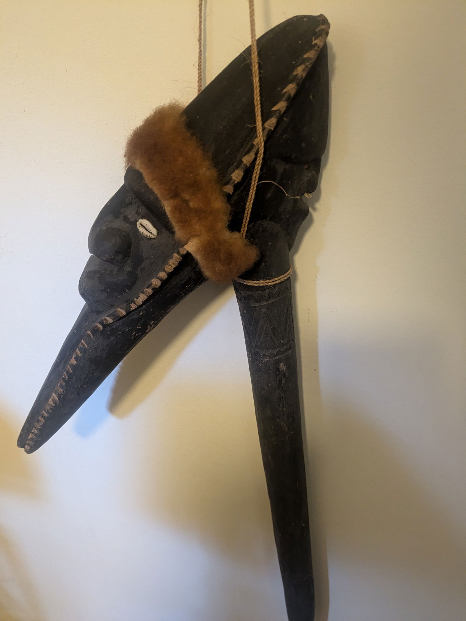 Carved Hook with Tree Kangaroo: Title: Carved Hook with Tree Kangaroo Description:One carved face with shell eyes and tree kangaroo headband, the other with “bone” nose ornament. Date/Period: Late 20th Century Materials:wood