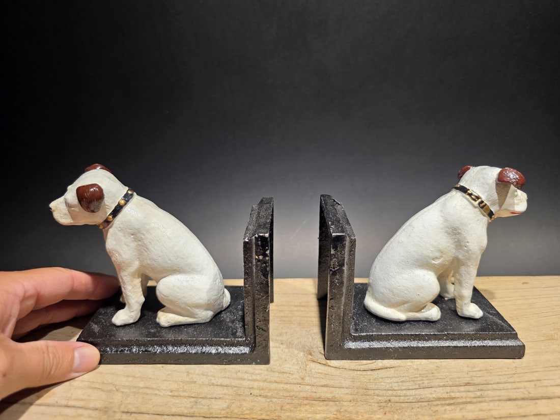 Pair of Cast Iron Nipper Dog Bookends: 5 L x 3 W x 4.5 H 5 L x 3 W x 4.5 H Great reproduction pair of cast iron bookends featuring Nipper, the famous dog from the HMV (His Master's Voice) logo. It's a special and useful piece for any colle
