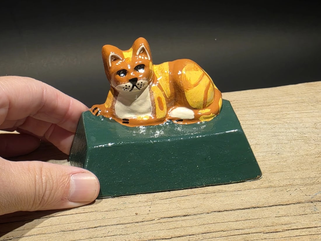 Cast Iron Cat Door Stop Wedge: 3"H x 4.5"L x 2"W Vintage-style cast iron cat door stop inspired by early folk-art and painted iron doorstops once common in American homes. Solid and weighty with hand-painted details, this piece off