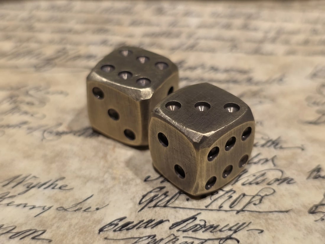 (2) 5/8" Solid Heavy Brass Metal Dice: matched pair of solid metal dice with a premium antiqued brass or bronze finish. These are substantial pieces, likely intended as high-end game accessories, executive desk toys, or unique pocket carri