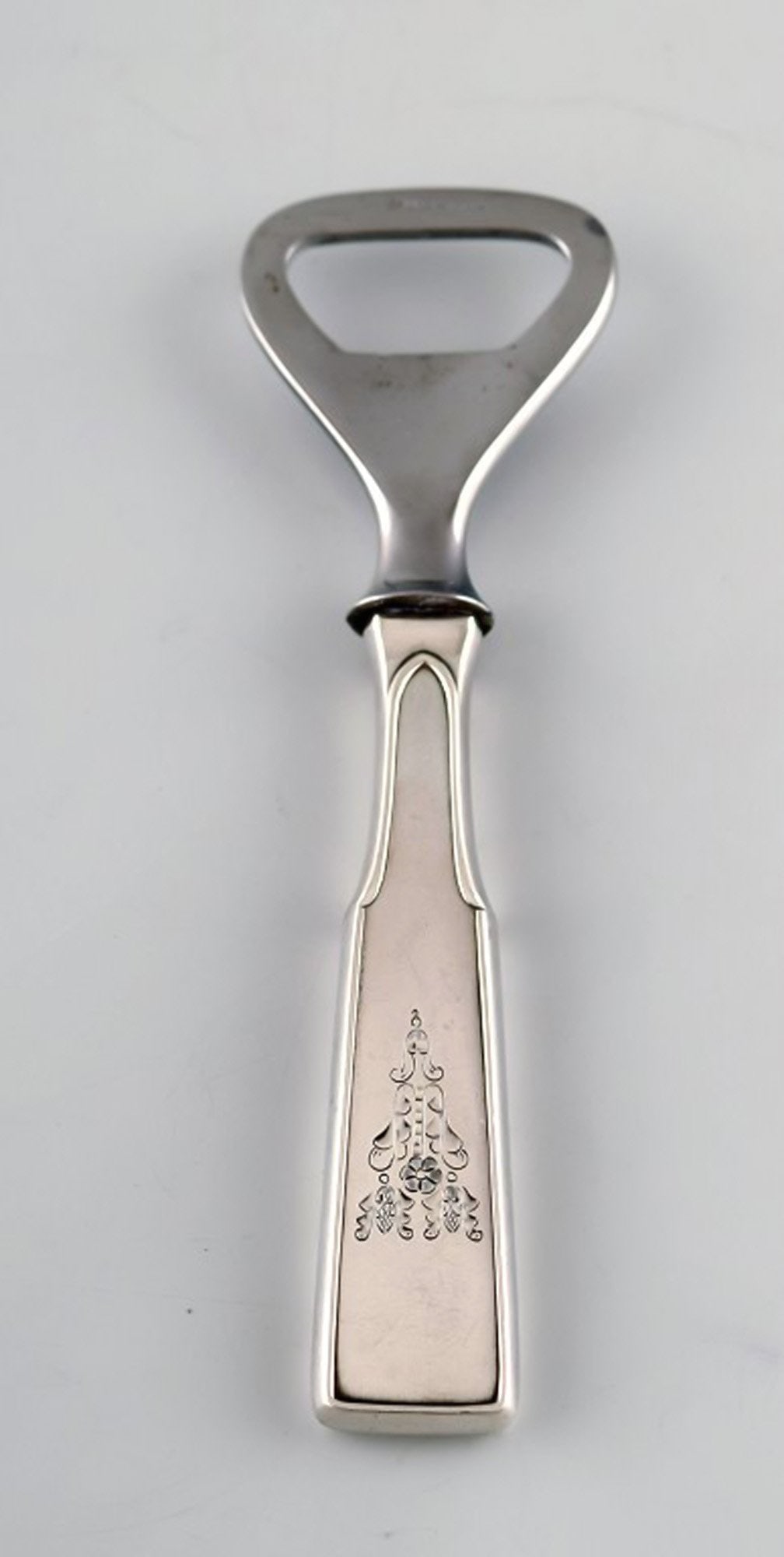 Hans Hansen silverware number 2. Bottle opener in danish silver and stainless steel.: Title:Hans Hansen silverware number 2. Bottle opener in danish silver and stainless steel. Description:Hans Hansen silverware number 2. Bottle opener in danish silver and stainless steel. Measures: 13