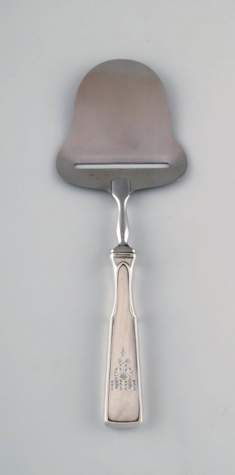 Hans Hansen silverware number 2. Cheese slicer in all silver and stainless steel.: Title:Hans Hansen silverware number 2. Cheese slicer in all silver and stainless steel. Description:Hans Hansen silverware number 2. Cheese slicer in all silver and stainless steel. Measures: 21,7 cm