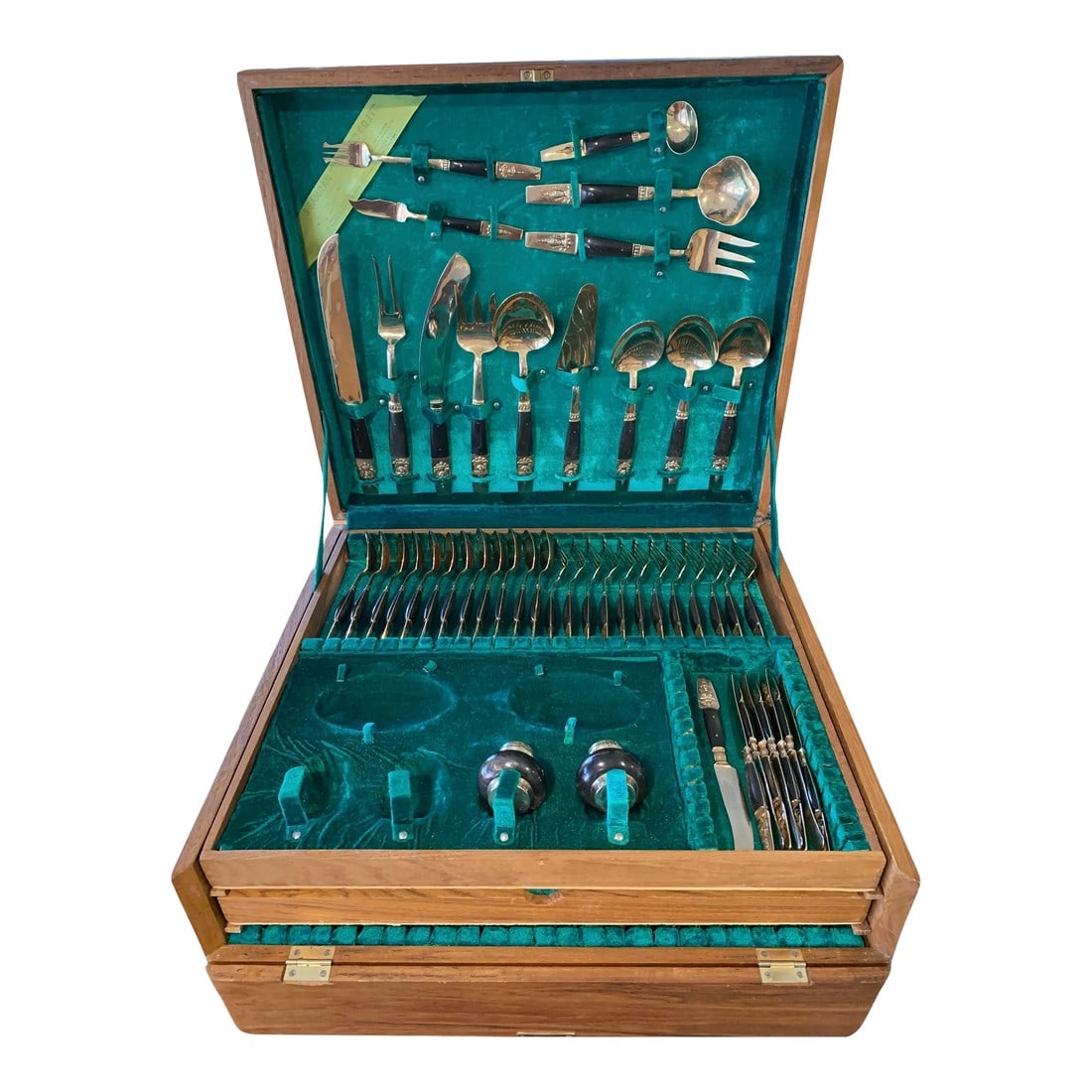 1960's Siam Thailand Rosewood & Brass Flatware Set - 132 Pcs.: Vintage 1960s set of handmade rosewood and brass Siam Thai 132 piece flatware set with the green velvet lined three tier wooden box with slots and straps. Marked "S. Samran Thailand, Ltd." Light wear.