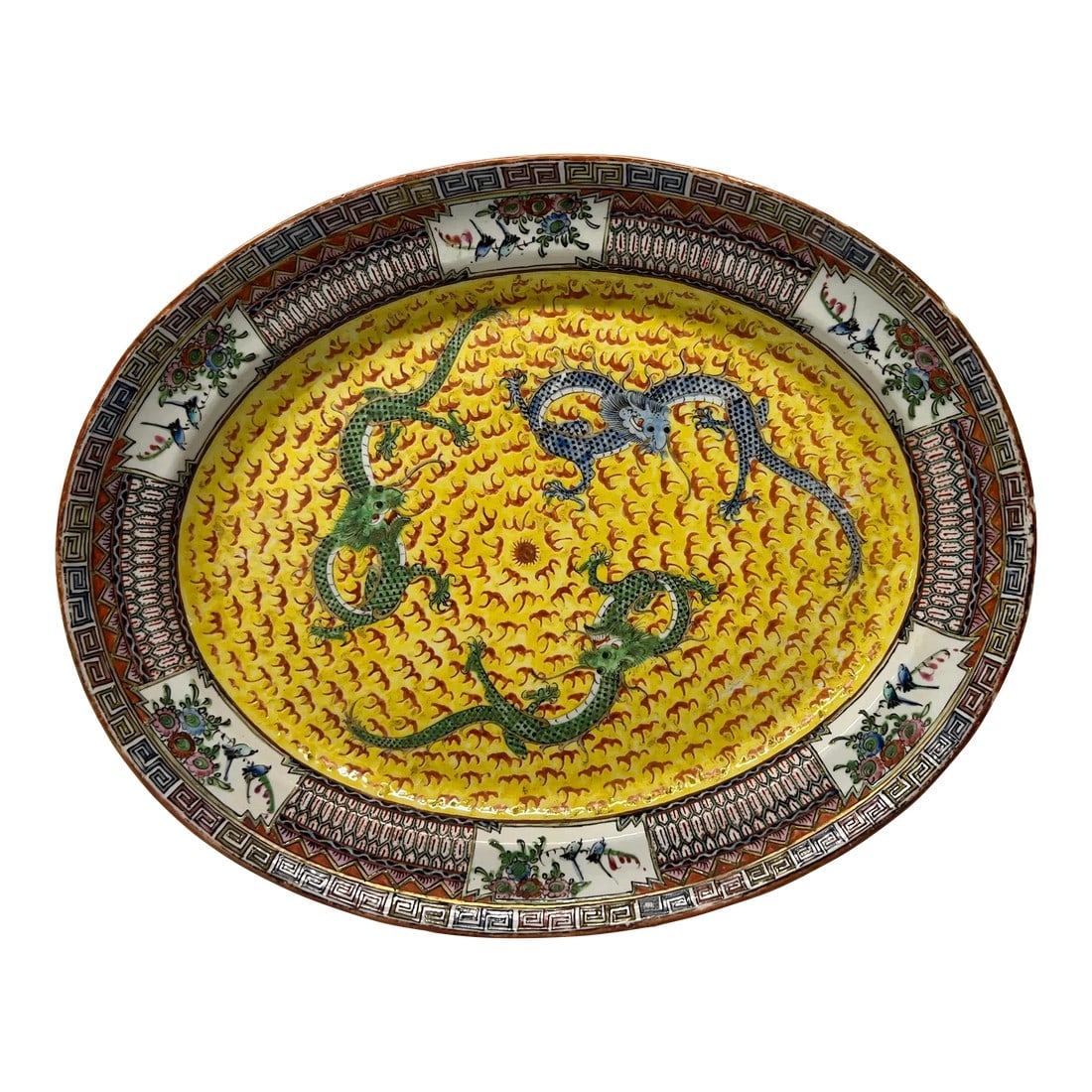 19th Century, Chinese Export Famille Jaune Imperial Dragon Platter: Chinese, early to mid 19th century. An antique famille jaune platter decorated with 3 imperial dragons chasing the central pearl. A good quality enameled edge with greek key style bordering. Marked to