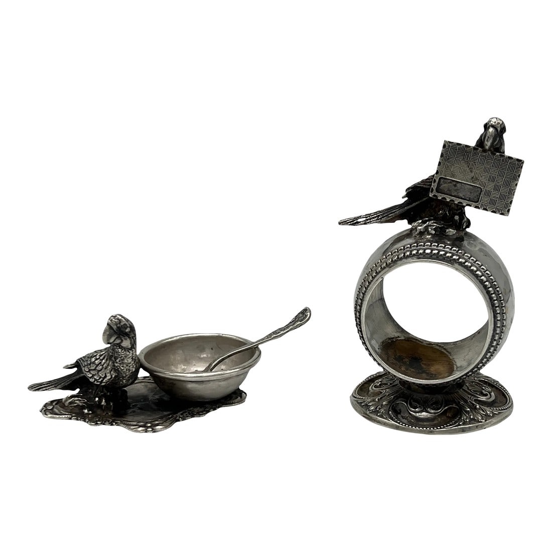 Antique Parrot Form Silver Plated Table Accessory Set - Napkin Ring + Salt Dish: Likely English, early to mid 20th century. A 3 piece grouping of silverplated tableware accessories including a napkin ring, salt dish and sterling salt spoon. Each piece is adorned with an adorable p