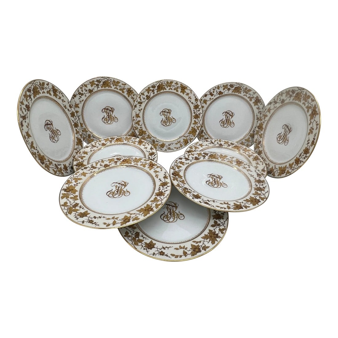 (10) Ten Fischer & Mieg Pirkenhammer Gilt Vine Encrusted Porcelain Dinner Plates: Fischer & Mieg Pirkenhammer (German, 19th century). A set of 10 stunning porcelain dinner plates. Each plate is overly decorated with daisy floral and vines to rim and a geometric form to inner border