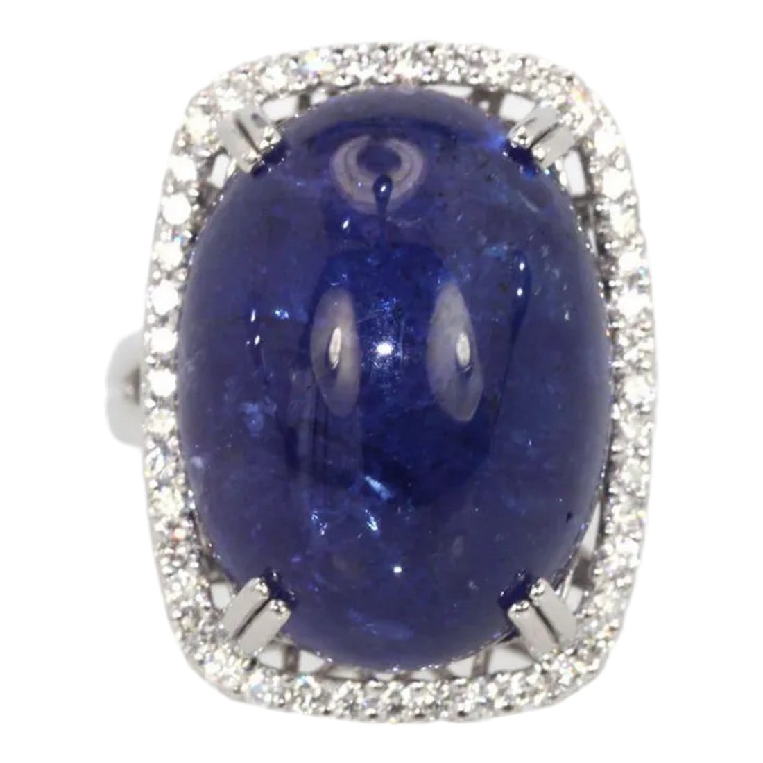 Tanzanite 35.39 Ct Cabochon High Dome Ladies Ring Size 6.5: This is part of Chairish's Fine Jewelry assortment. WEIGHT: 19.80 grams MAIN STONE: Tanzanite OTHER STONES: Diamonds, 1.25 carats, VVS-SSI clarity, G-H color METAL: 18k white gold SIZE: 6.5 (resizable