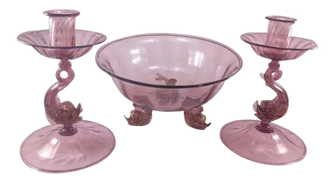 Venetian/Murano Glass Three Piece Console Ensemble Set: This lovely and delicate Venetian glass console set by Antonia Salviati consists of two candle holders and one compote, each in purple. Candleholder stems and three compote feet are in the form of dol