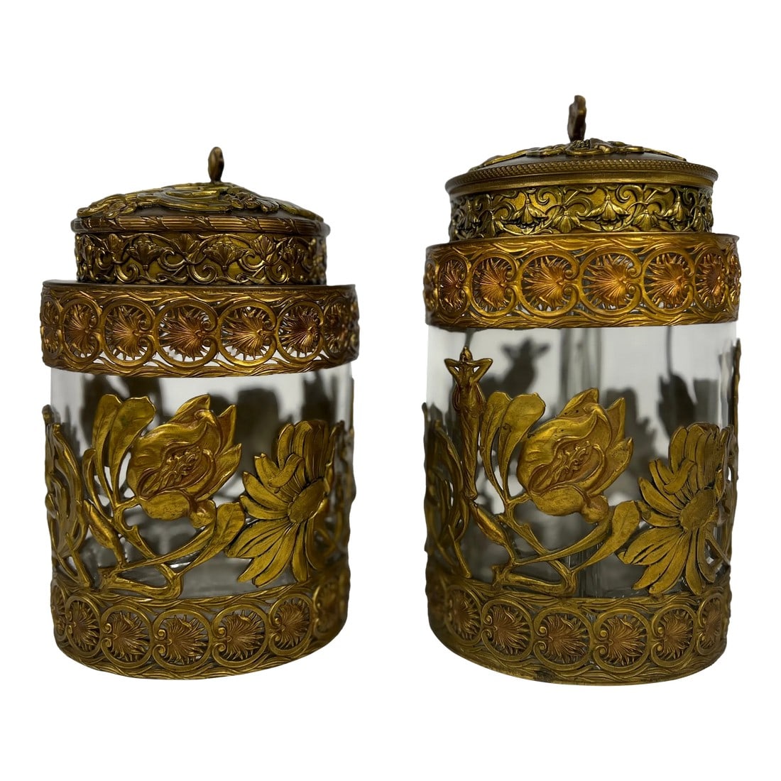 Fine Gentleman's Gilt Bronze Liquor and Cigar Set Art Nouveau Period C. 1900: This exquisite antique liquor and humidor set combines delicate craftsmanship and functional elegance. Each piece is crafted from clear glass encased in gilded bronze filigree, showcasing intricate fl