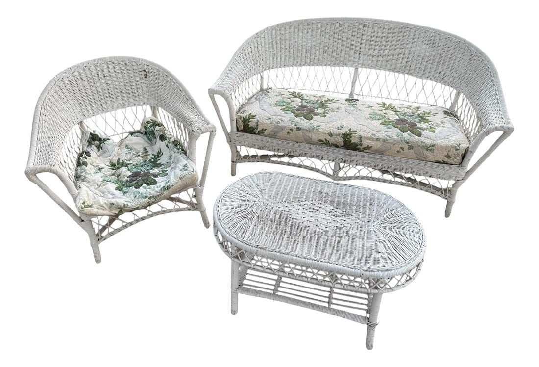 Antique White Wicker Loveseat, Side Chair, and Coffee Table With Quilted Upholstery, 3 Pieces: Antique White Wicker Loveseat, Side Chair, and Coffee Table Set with Quilted Upholstery The loveseat and side chair feature quilted upholstery. The loveseat cushion is mounted to a board with the orig