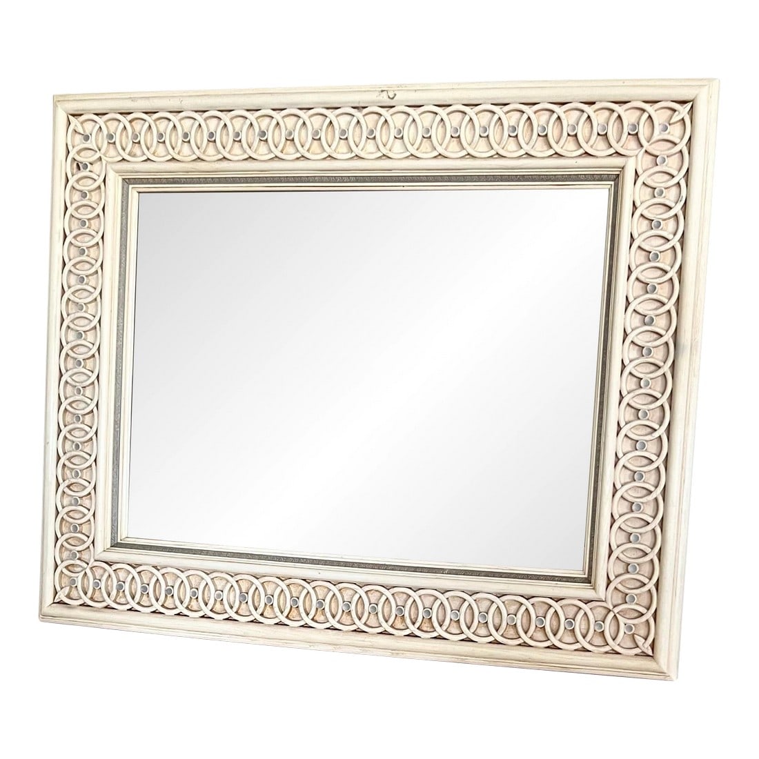 Early 20th Century Large Beveled Ivory Mirror: Amazing repeat pattern mirror with wide border and beveled mirror. The whitewash wood frame with lustrous painted finish buffed to a smooth polish over multi shades of white. The beveled glass appears