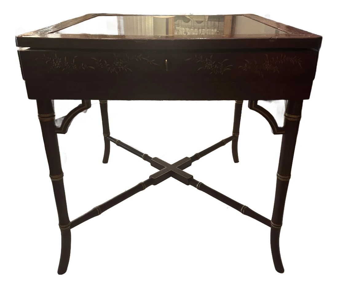 Red Chinoiserie 19th Century Lacquer Table With Lift Top and Key: Works good as a side table or occasional table. Great for magazine storage or in a library with newspapers or documents. Key works. Decorated in the Chinese style with Asian figures at leisure in blac