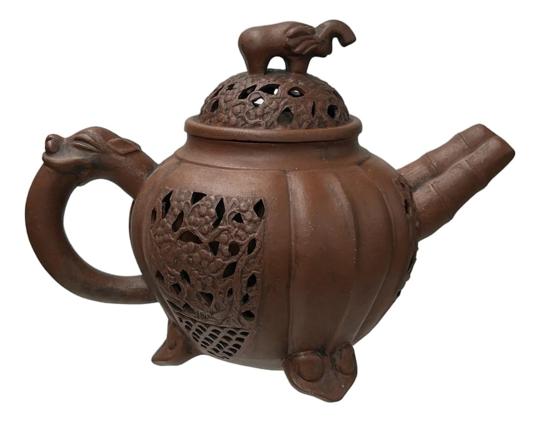 Vintage Brown Pumpkin Elephant Zisha Clay Teapot Art Display: This exquisite dark reddish-brown earthenware teapot, adorned with intricate openwork designs of foliage and geometric patterns, promises to be a conversation starter. Its unique design features a sty