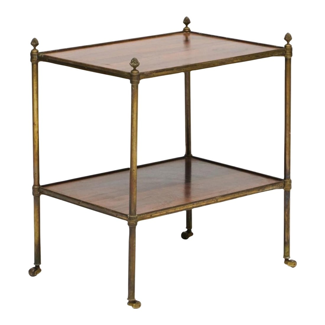 1930s Brass and Rosewood Two Tier French Side Table in the Manner of Billy Baldwin and Jansen: Classic chic 20th century two tier brass table in rosewood with lovely brass finials. Often mad by Jansen and popular by interior designer such as Billy Baldwin and Mario Buatta. On casters Condition: