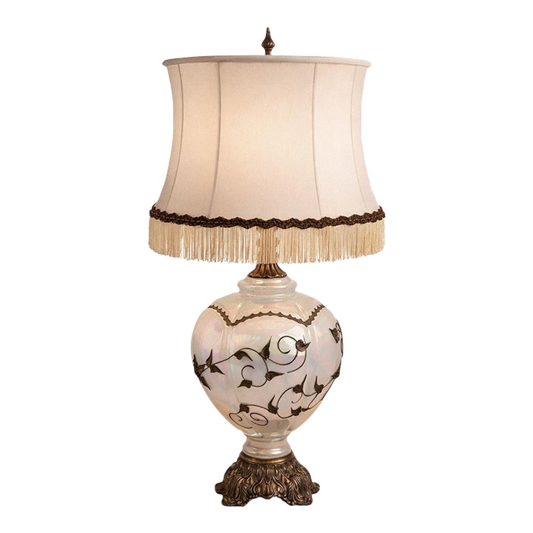 Vintage Hollywood Regency Opaline Glass Table Lamp With Metal Filigree, Circa 1960s–1970s: This vintage Hollywood Regency table lamp features a luminous opaline glass body with an iridescent finish, embellished with applied metal vine and leaf filigree. The rounded glass form is paired with