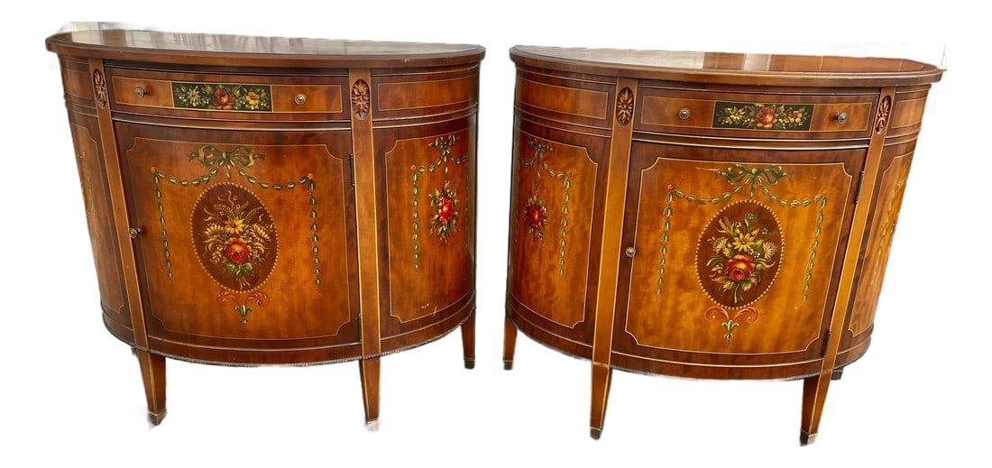 Mid 20th Century Pair of Grand Rapids Imperial Furniture Demilune Adams Style Paint Decorated Cabine: This is a sweet pair of demilune cabinets with beautiful grained veneer painted in the Adams style, each having a gorgeous floral bouquet on the front and smaller ones on the sides surrounded by garla