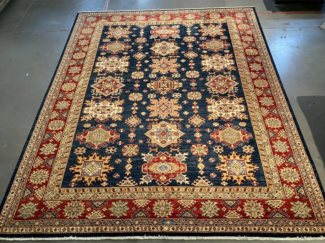 FINE SUPER KAZAK RUG 8'.1"x9'.10": Title:FINE SUPER KAZAK RUG 8'.1"x9'.10"Description:8'.1"x9'.10" Super quality Kazak Rug, hand spun and hand knotted rug in Pakistan 100% Vegge Dye natural wool Pile , in Vivid Navy , Rustic red and
