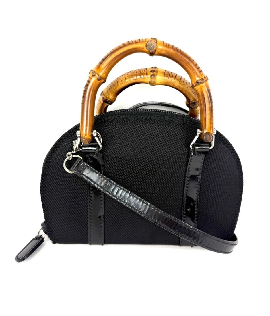 Gucci Bamboo Half Moon Mini Black Canvas Crossbody Bag: Title: Gucci Bamboo Half Moon Mini Black Canvas Crossbody Bag Description: Pre-Owned 100% Authentic Gucci Bamboo Half Moon Mini Black Canvas Crossbody Bag RATING: B-... Good, shows minor signs of wear