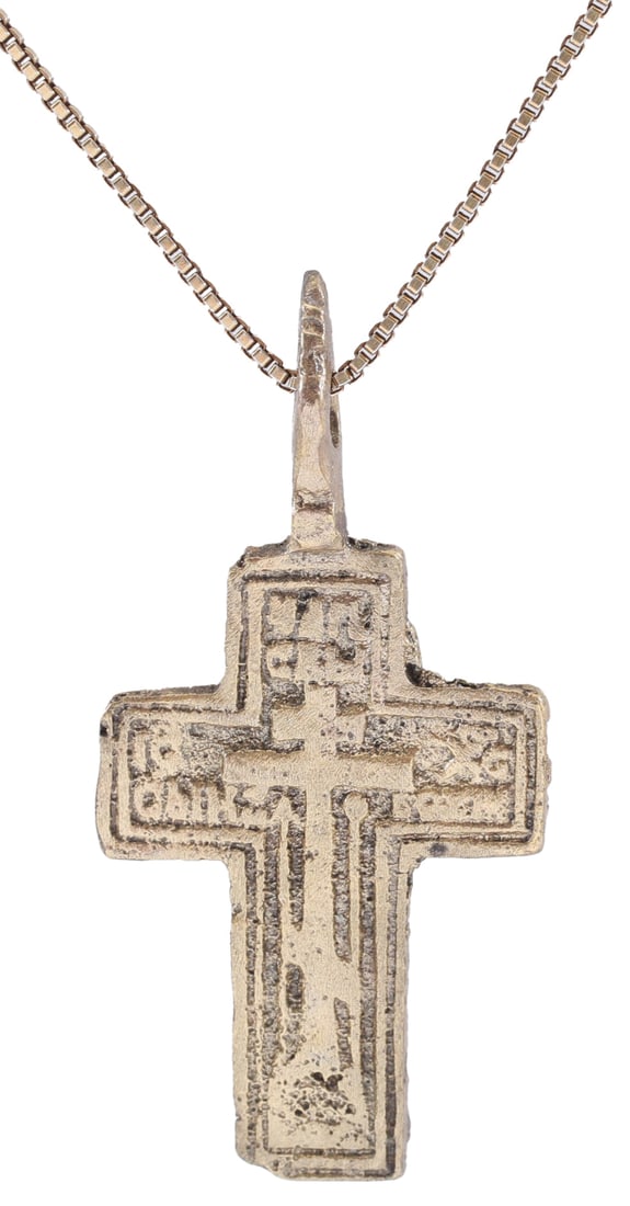EASTERN EUROPEAN (UKRANIAN) CHRISTIAN CROSS, 17th-18th CENTURY: 17th-18th C.AD. Southern Russian, or Ukrainian. Good heavy example, over 1 3/8" (1.43) total height with heavy suspension loop. Gilt bronze with a cross on the front with raised borders. The reverse w