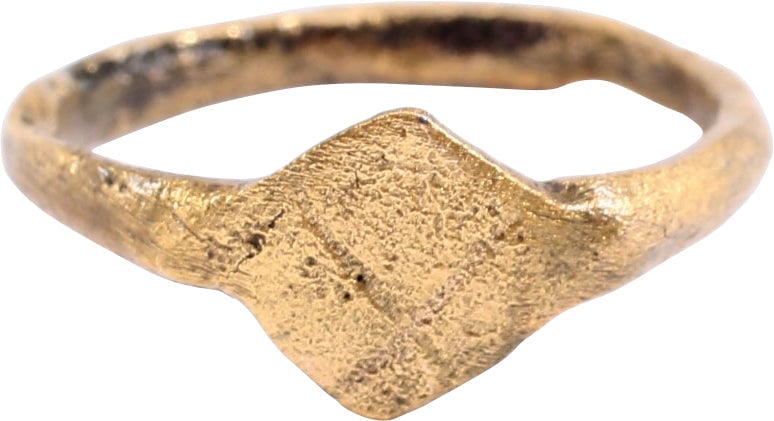 MEDIEVAL WOMAN’S FASHION RING SIZE 4 1/4: C.900-1300 AD. 4 1/4. 3.0 low rounded band slightly flaring to the shoulders. Diamond shaped bezel engraved with an offset X or saltire, probably meant as a signet. This ring, by its quality, would ha