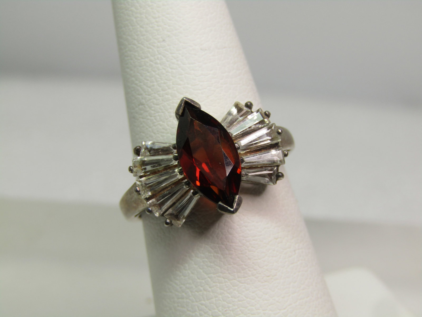 Vintage Sterling Garnet & White Topaz Ring, Sz. 7, 1980's-1990's , Signed: Vintage Sterling Garnet & White Topaz Ring, Sz. 7, 1980's, Signed with what looks like a bird outlined image. It is marked .925 and tests as sterling with an appx. weight of 4.11 grams. The main