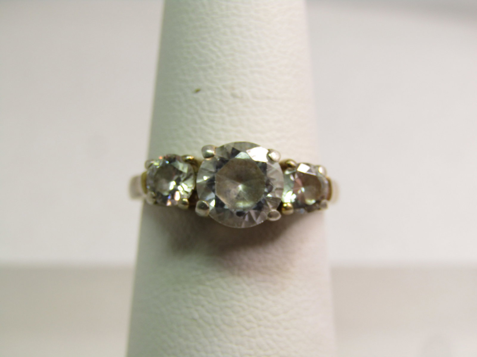 Vintage Sterling CZ ring, Engagement/Anniversary, Sz. 5 Signed DBJ, 1980's: Vintage Sterling CZ ring, Engagement/Anniversary, Sz. 5 Signed DBJ, 1980's. Three stones - the center is an appx. 6mm with an appx. 3.8mm round stne on each side. This has a gold plating over the