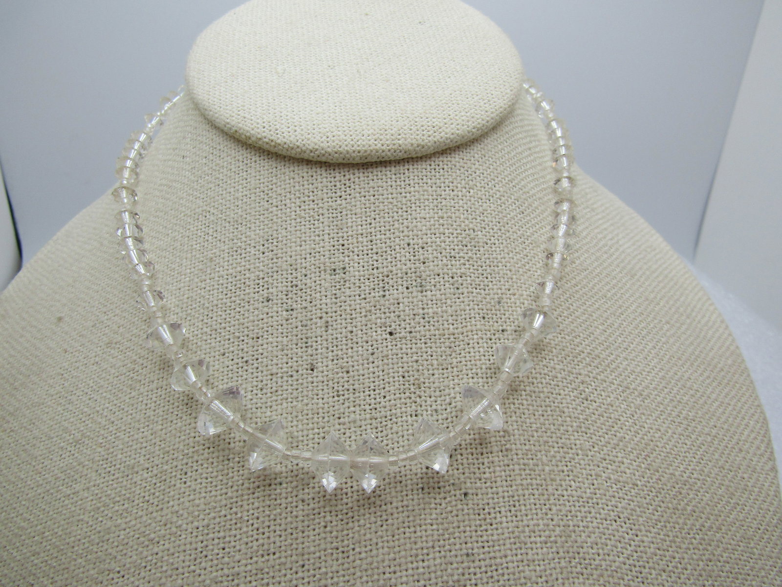 Vintage Graduated Crystal Beaded Necklace, 14.5". 1940's-1950's: Vintage Graduated Crystal Beaded Necklace, 14.5". 1940's-1950's. The beads range from 2mm to 9mm. There are clear glass seed beads and diamond shaped faceted crystal beads. Silver tone box clasp. 
