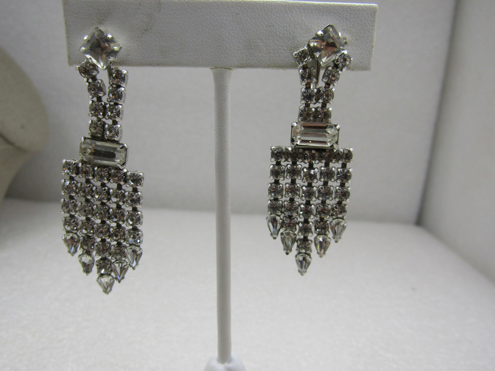 Vintage Rhinestone Art Deco Drop Earrings, Screwback 2-1/8": Vintage Rhinestone Art Deco Drop Earrings, Screwback 2-1/8" long and 3/4" wide. Art deco themed round, square, rectangular and pear-shaped clear rhinestones set in a dop design. Square stone on top,