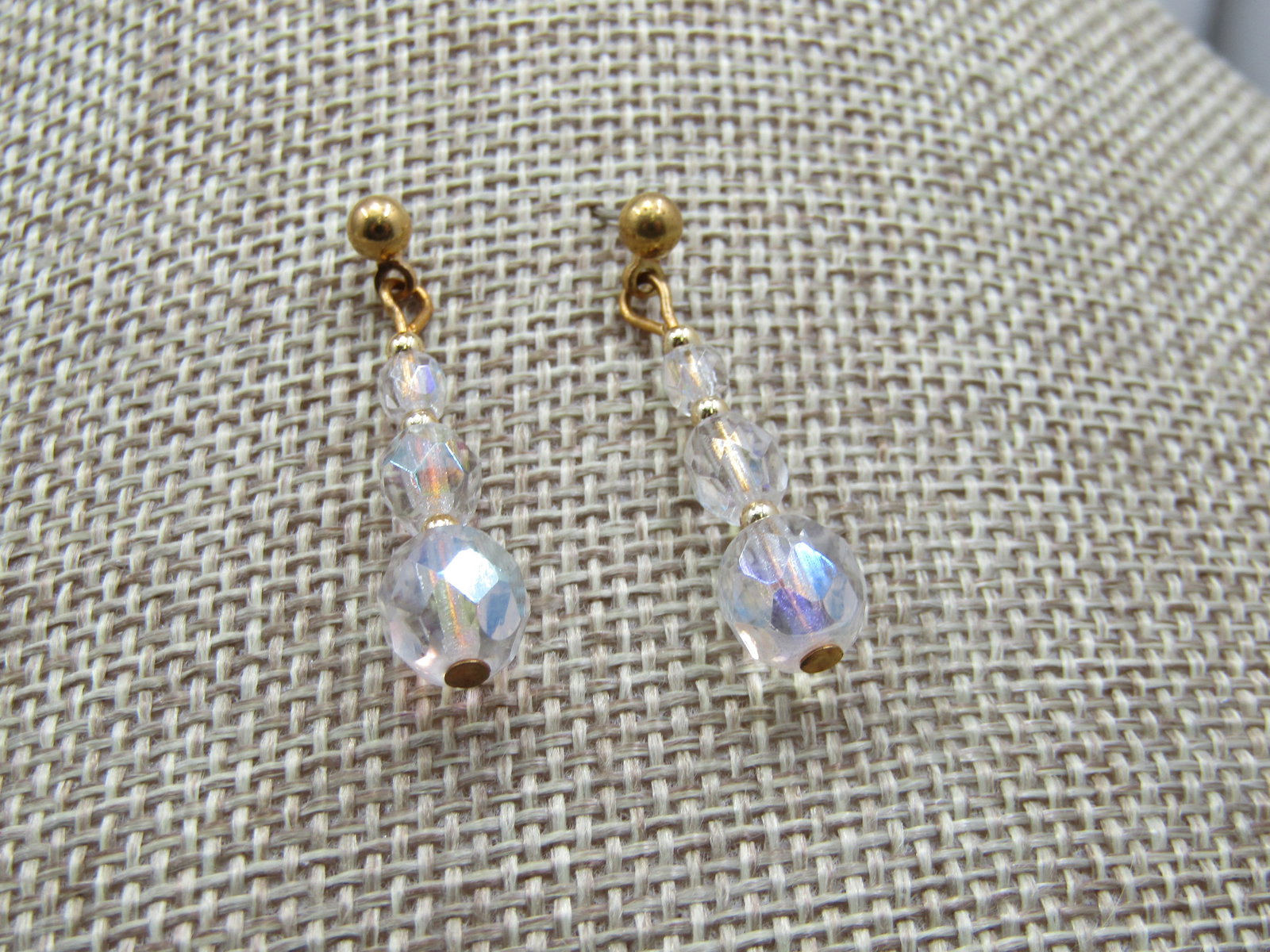 Aurora Borealis Crystal Beaded Earrings, Drop, Pierced, 1.25": Aurora Borealis Crystal Beaded Earrings, Drop, Pierced, 1.25". Three beads in graduated from 3.5mm to 5.5mm to 7mm. Ball stud with bead drop. Gold tone. Very good condition. Not signed by the maker.