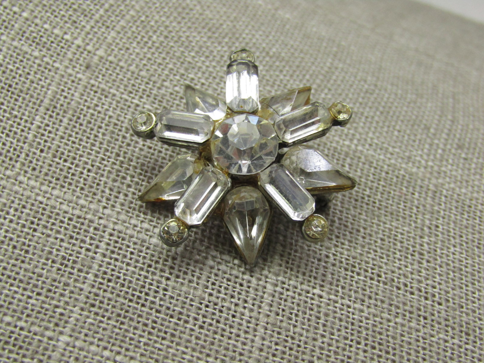 Vintage Sterling Rhinestone Art Deco Brooch, Signed HSB: Vintage Sterling Rhinestone Art Deco Brooch, Signed HSB, 1960's, apx. 9.06 grams. It has a half circle of clear baguettes on top with a mix of marquise and round stones on stem-like accents. There