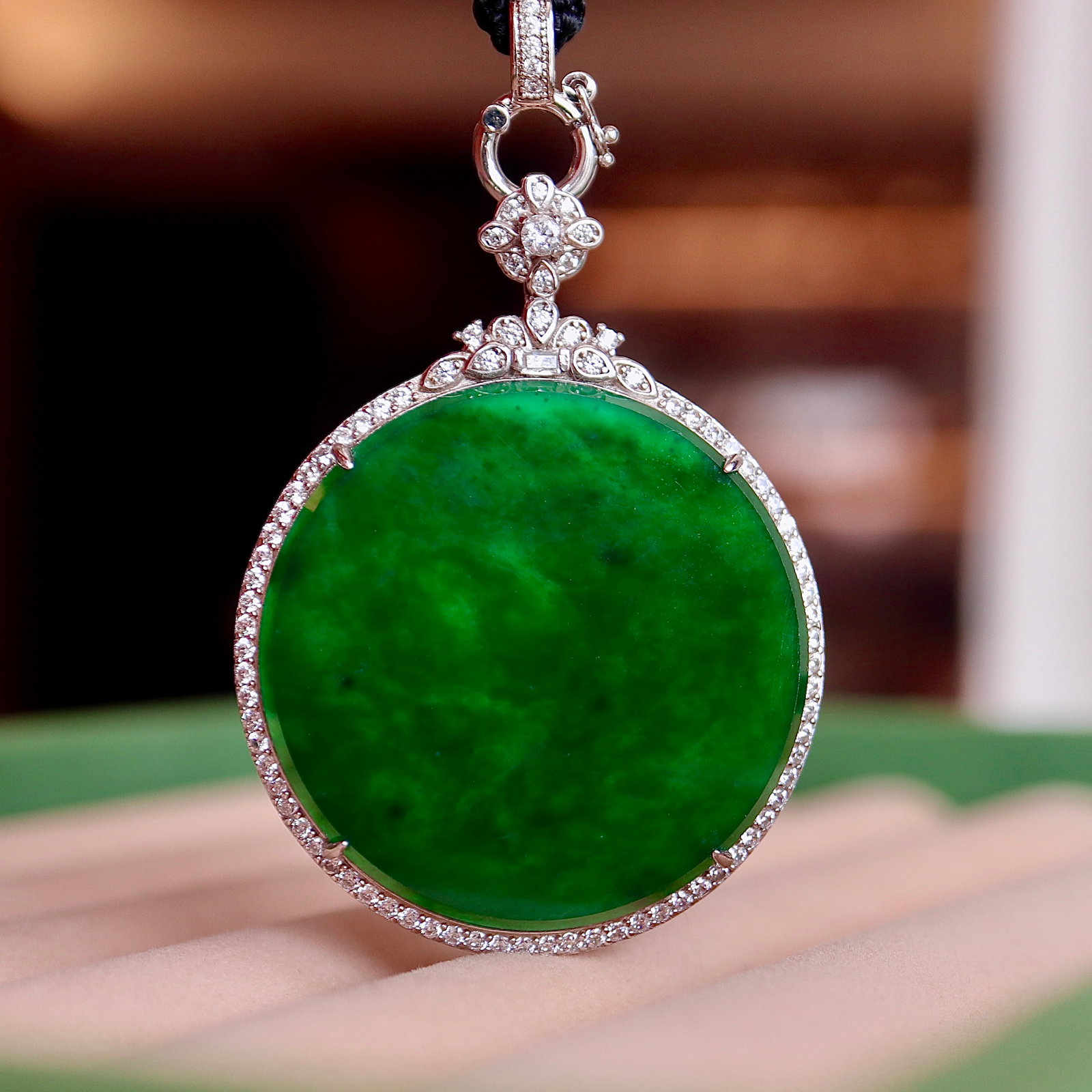 Jade Pendant: Title: Jade Pendant Description: This exquisite pendant showcases the rarity and luxurious quality of natural Type A jadeite, displaying a full green color and perfectly interpreting the essence of el