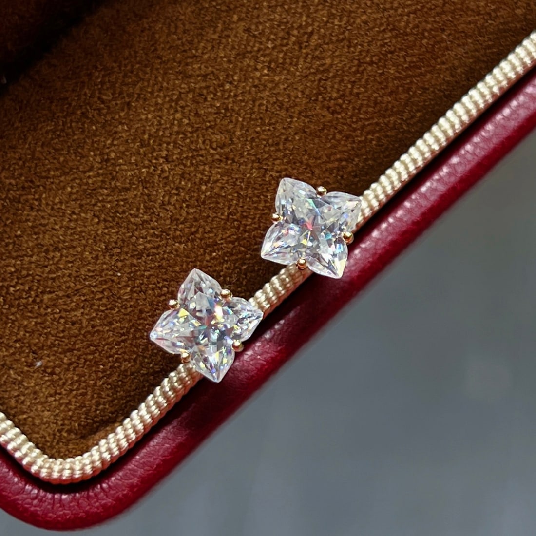 18K Gold Moissanite Stud Earrings: Title: 18K Gold Moissanite Stud Earrings Description: These earrings embody understated luxury, featuring a classic lily cut with a single Moissanite shining with a one-carat brilliance. The 18K gold