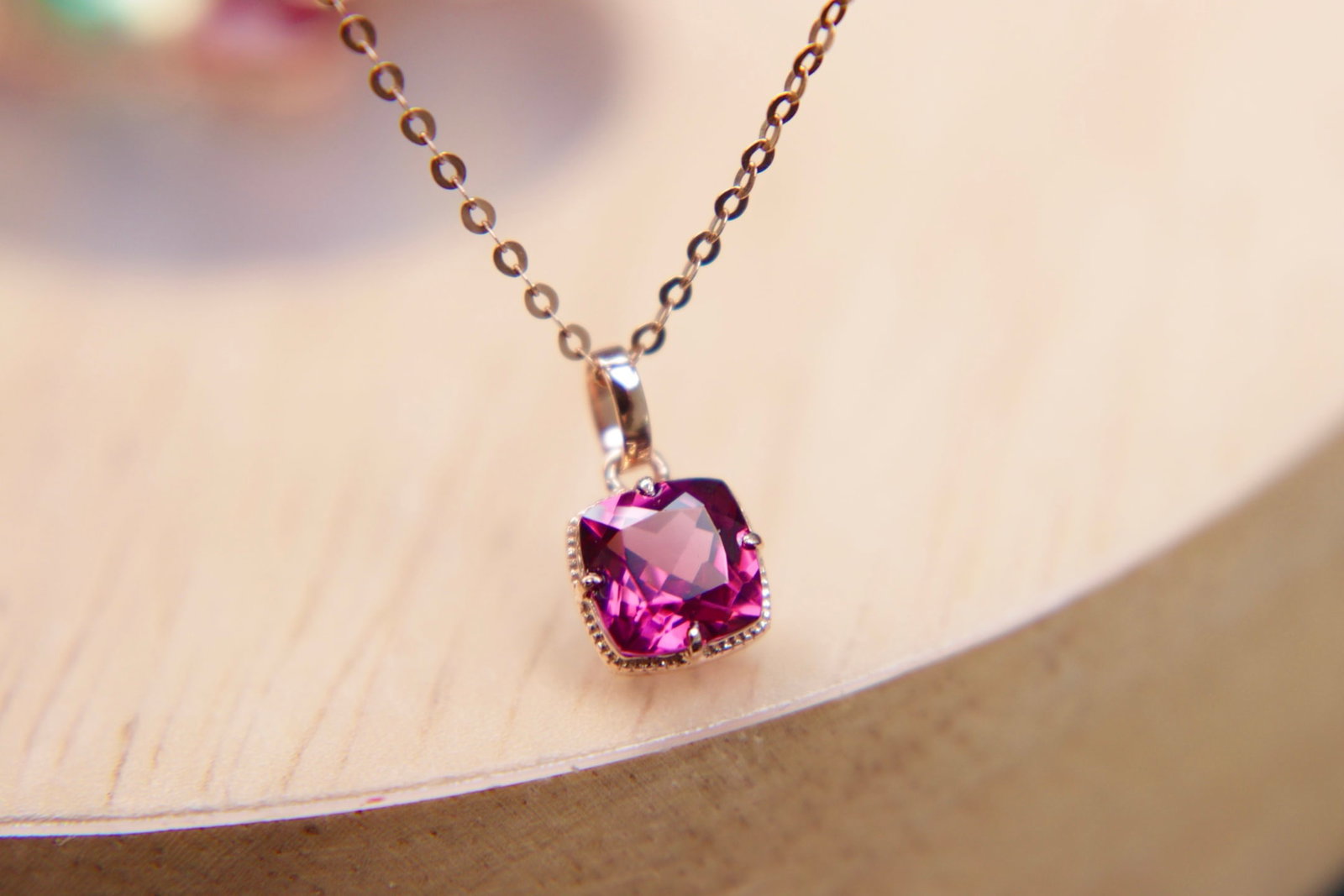 18K Gold Garnet Pendant: Title: 18K Gold Garnet Pendant Description: This pendant is meticulously crafted from luxurious 18K gold, showcasing the deep and enchanting charm of natural garnet. The rich color of the garnet