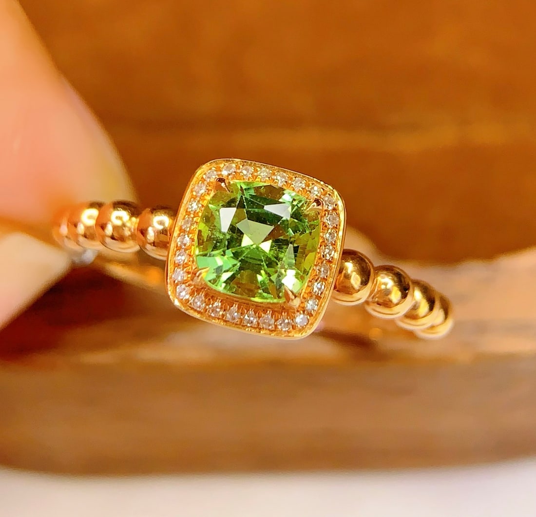 18K Gold Tourmaline Ring: Title: 18K Gold Tourmaline Ring Description: This 18K gold tourmaline ring is a symbol of timeless elegance and sophistication. The central natural tourmaline exudes captivating charm, making it a ver