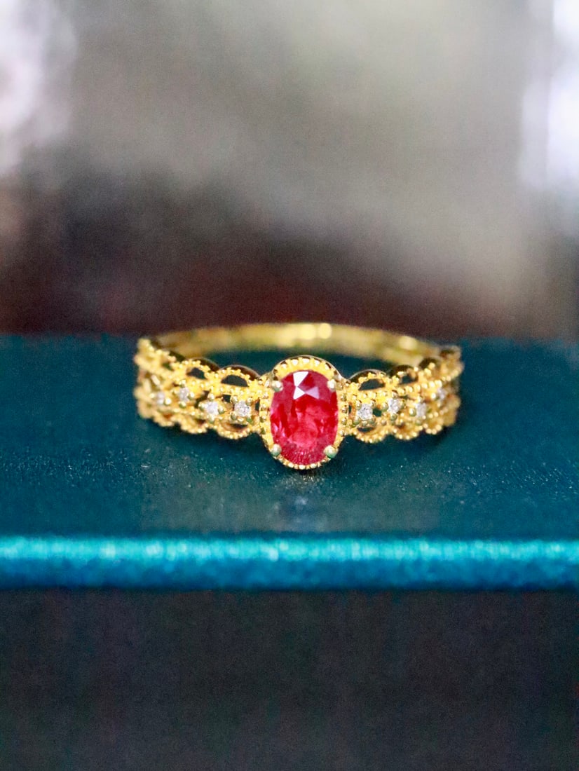 18K gold ruby ring: Title: 18K gold ruby ring Description: This 18K gold ruby ring combines the fiery charm of natural rubies with the elegant design of lace elements, presenting a sweet yet edgy style. Its versatile